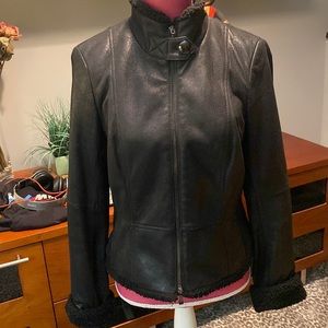 Genuine leather jacket with lambswool style trim on the collar, hem & cuffs.